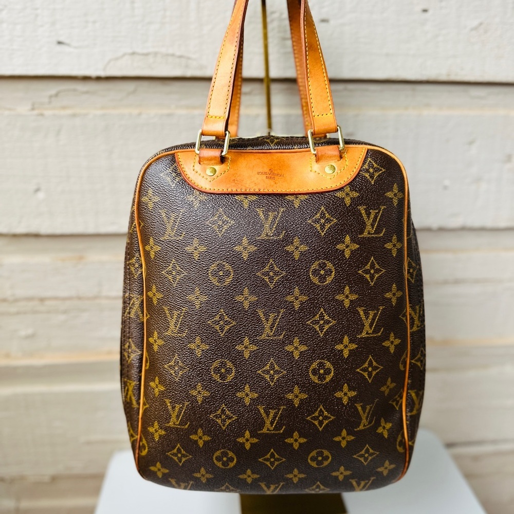 LOUIS VUITTON LV Excursion HandBag Monogram with Dustbag and COA.